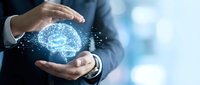 Businessman in formal suit holding glowing digital brain with neural network connections, representing artificial intelligence, innovation, and technology solutions for business growth.