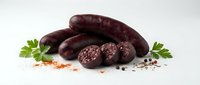Dark blood sausage with herbs and spices on white background, traditional European cuisine ingredient for gourmet cooking and culinary preparations.