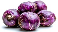 Fresh purple kohlrabi bulbs with vibrant layers and natural texture on white background, macro food photography showing organic vegetable details.