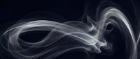 Elegant white smoke swirls flowing gracefully against dark background creating abstract ethereal patterns for modern design projects and artistic compositions.