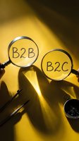 Two magnifying glasses displaying B2B and B2C text on yellow background with compass and pen, representing business model comparison and market research strategy.