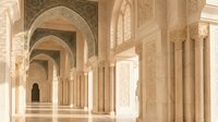 Elegant Islamic architecture corridor with ornate arches, detailed columns and intricate geometric patterns creating stunning perspective in mosque interior.