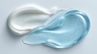 Smooth white and blue cosmetic gel smears on light background, showcasing skincare product texture for beauty industry advertising.