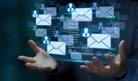 Business professional managing digital email marketing campaign with floating holographic interface and communication icons for corporate strategy.