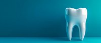 White tooth model against turquoise blue background, dental care concept for dentistry, oral hygiene, and healthcare professionals.