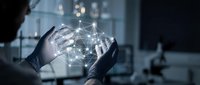 Professional hands holding glowing digital network sphere with connected nodes representing global connectivity and data technology innovation.