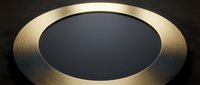 Brushed gold metallic ring frame with dark center space on black background, suitable for product displays, web design, and luxury branding applications.