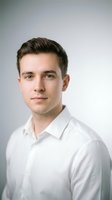 Professional young Caucasian businessman in white dress shirt portrait against neutral background for corporate headshot and business marketing materials.