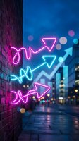 Colorful neon arrows glowing on brick wall in urban street at night with bokeh lights creating vibrant business growth and direction concept.