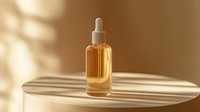 Luxury golden serum bottle with dropper on marble surface in warm sunlight for skincare and beauty product advertising campaigns.