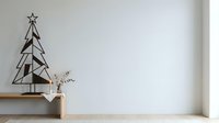 Minimalist metal Christmas tree decoration with star on wooden shelf next to white vase with dried botanicals, modern holiday home decor.