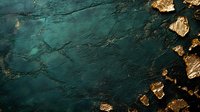 Aerial view of emerald ocean water meeting golden rocky coastline, creating dramatic contrast between deep turquoise sea and sun-lit shore formations.