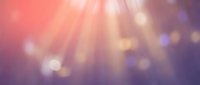 Abstract gradient background with soft pink and purple colors featuring warm light rays and bokeh effects for modern design projects.