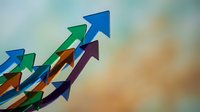 Colorful arrows pointing upward against blurred background representing growth, success, progress and business development concepts for presentations.