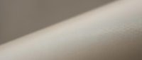 Smooth beige textured surface with soft lighting and subtle shadows creating minimalist abstract background for modern design projects.