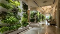 Elegant indoor vertical garden in luxury hotel corridor with hydroponic plants, crystal chandelier, and polished marble floors creating serene biophilic design.