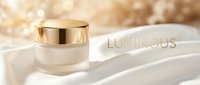 Luxury cream jar with gold lid on white silk fabric with luminous bokeh background, suitable for cosmetics, skincare, and beauty product marketing.