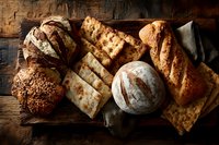 Assortment of freshly baked artisan breads and crackers on rustic wooden board with linen napkin, showcasing variety of textures and baking styles.