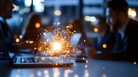 Business professionals collaborating with digital innovation sparks and glowing particles emerging from laptop screen in modern office environment.