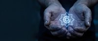 Elderly hands cupping glowing atomic symbol representing nuclear energy, science education, physics concepts, and sustainable power technology solutions.
