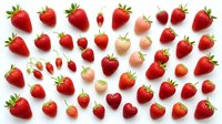 Fresh ripe strawberries collection isolated on white background. Various sizes and angles of red berries with green leaves for healthy food design.