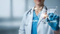 Female doctor in white coat using futuristic digital interface technology for medical data analysis and healthcare innovation in modern hospital setting.