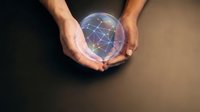 Hands holding glowing sphere with network connections representing global connectivity, technology innovation and digital transformation concepts.