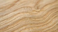 Light oak wood grain texture with natural wavy patterns and warm beige tones, suitable for flooring, furniture design, and interior decoration projects.