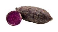 Whole and sliced purple sweet potato isolated on white background, raw vegetable for cooking and nutrition.