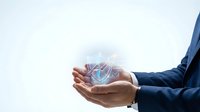 Business professional holding glowing digital network sphere with connected nodes representing technology innovation and global connectivity solutions.