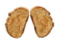 Two slices of toasted whole grain bread isolated on white background, ready for breakfast, sandwich, or bakery design projects.