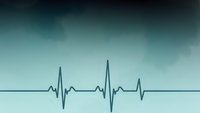 Medical heartbeat pulse rhythm line on gradient blue background for healthcare and cardiology concepts.