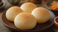 Traditional Chinese pineapple buns with golden cracked tops on wooden plate, Asian bakery pastries for food photography and culinary content.