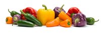Fresh colorful bell peppers and chili peppers arranged in a row, including red, yellow, orange, purple and green varieties. Use for cooking, nutrition, healthy eating and food photography.