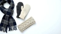 Winter accessories flat lay with plaid scarf, knitted mittens and cable knit headband on white background for seasonal fashion and cozy style concepts.
