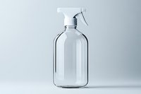 Clear glass spray bottle with trigger sprayer on minimal gray background, isolated cleaning container for mockup and product design presentation.