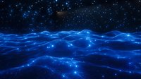 Glowing blue waves under starry night sky create ethereal seascape with luminescent water surface, mystical ocean landscape with bioluminescent effect.