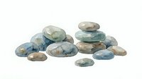 Watercolor painted stones and pebbles in soft blue, gray, and beige tones isolated on white background, suitable for design projects and illustrations.