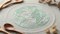 Zen garden sand with carved leaf pattern and wooden spoons, creating a peaceful meditation space for relaxation and mindfulness practice.