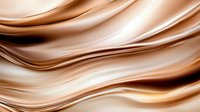 Smooth flowing waves in luxurious caramel and cream tones create elegant abstract background with silky texture and gentle curves for modern design projects.