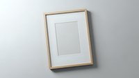 Empty wooden picture frame with white mat hanging on gray wall ready for artwork display and home decor projects.
