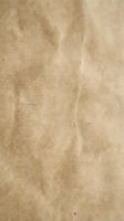 Aged brown paper texture with natural wrinkles and creases for vintage design projects and artistic backgrounds.