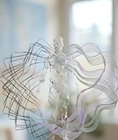 Human silhouette with flowing abstract lines and water splash effect on blurred background for creative design projects.