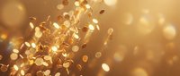 Golden coins falling through warm bokeh light creating magical wealth and prosperity atmosphere for financial success concepts.