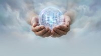 Hands holding glowing digital city hologram against cloudy sky background. Represents smart city technology, urban development, innovation, and future infrastructure solutions.