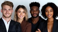 Diverse group of young professionals smiling at camera against light background, representing teamwork, inclusion and modern business collaboration.