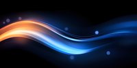 Dynamic flowing waves of orange and blue light create abstract motion effect against dark background with glowing bokeh elements and smooth curves.