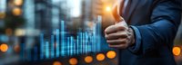 Businessman in dark suit giving thumbs up gesture with financial growth chart and city skyline background, representing success, approval, and positive business performance.