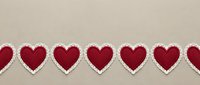 Red fabric hearts with white lace trim arranged in row on beige background for Valentine's Day crafts, romantic decorations and love-themed projects.