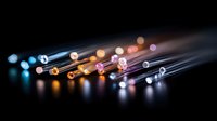 Glowing fiber optic cables with colorful light trails on dark background, modern telecommunications technology concept for high-speed internet and data transfer.